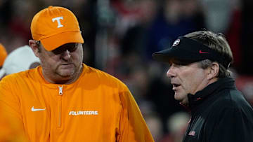 Tennessee head coach Josh Heupel shanks hands with Georgia head coach Kirby Smart before the start of a NCAA college football game against Tennessee in Athens, Ga., on Saturday, Nov. 16, 2024.
