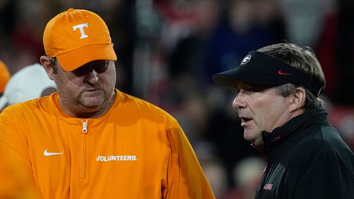 Tennessee head coach Josh Heupel shanks hands with Georgia head coach Kirby Smart before the start of a NCAA college football game against Tennessee in Athens, Ga., on Saturday, Nov. 16, 2024.