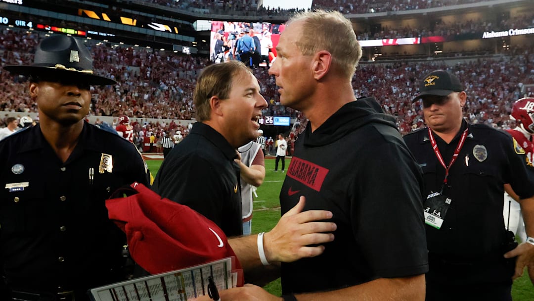 Missouri Tigers head coach Eliah Drinkwitz (left) talks with Alabama Crimson Tide head coach Kalen DeBoer (right) after a game at Bryant-Denny Stadium. 
