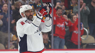 Apr 17, 2025; Pittsburgh, Pennsylvania, USA;  Washington Capitals left wing Alex Ovechkin (8) acknowledges the crowd as a video tribute of his career is played by the Pittsburgh Penguins during the first period at PPG Paints Arena. Mandatory Credit: Charles LeClaire-Imagn Images