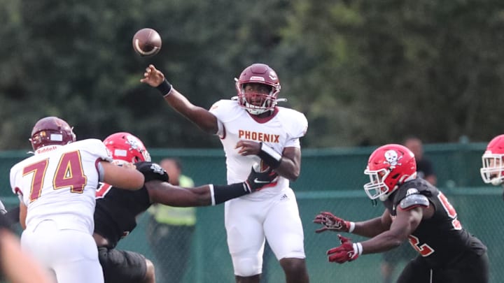 New Hampstead quarterback Rashawn Truell passes the ball under pressure from the Savannah Christian defense on Friday, August 23, 2024 at Pooler Stadium.