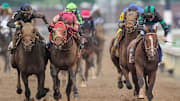 Near the finish line, jockey Tyler Gaffalione, left, and Forever Young's jockey Ryusei Sakai crowd after the two horses bumped and Mystik Dan with jockey Brian J. Hernandez, right, won the 2024 Kentucky Derby at Churchill Downs Saturday, May 4, 2024 in Louisville, Kentucky.
