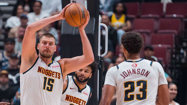 Nikola Jokic, Jamal Murray and Cam Johnson