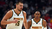 Oct 14, 2025; Denver, Colorado, USA; Denver Nuggets forward Peyton Watson (8) after scoring on an assist by center Nikola Jokic (15) during the first half at Ball Arena.