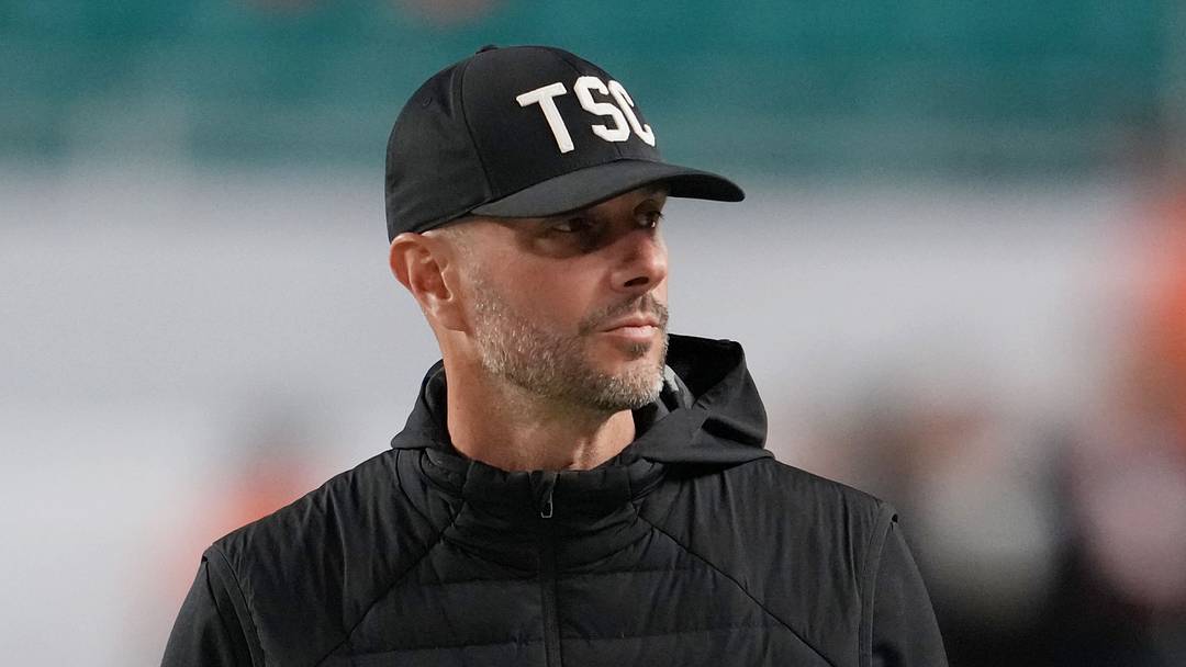 Jan 19, 2026; Miami Gardens, FL, USA; Las Vegas Raiders general manager John Spytek walks on the sideline before the CFP National Championship college football game between the Indiana Hoosiers and the Miami Hurricanes at Hard Rock Stadium. Mandatory Credit: Kirby Lee-Imagn Images