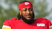 Jul 26, 2024; Kansas City, MO, USA; Kansas City Chiefs offensive tackle Lucas Niang (77) walks from the locker room to the fields prior to training camp at Missouri Western State University. Mandatory Credit: Denny Medley-Imagn Images