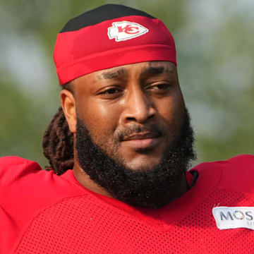 Jul 26, 2024; Kansas City, MO, USA; Kansas City Chiefs offensive tackle Lucas Niang (77) walks from the locker room to the fields prior to training camp at Missouri Western State University. Mandatory Credit: Denny Medley-Imagn Images
