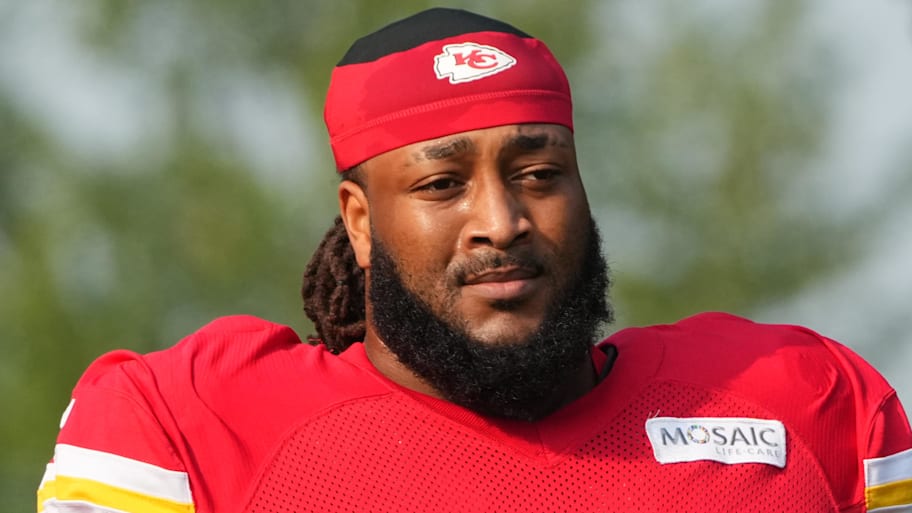 Jul 26, 2024; Kansas City, MO, USA; Kansas City Chiefs offensive tackle Lucas Niang (77) walks from the locker room to the fields prior to training camp at Missouri Western State University. Mandatory Credit: Denny Medley-Imagn Images | Denny Medley-Imagn Images