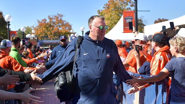 Oct 19, 2024; Champaign, Illinois, USA; Illinois Fighting Illini head coach Bret Bielema leads his team into the stadium befo