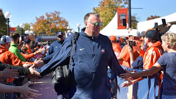 Oct 19, 2024; Champaign, Illinois, USA; Illinois Fighting Illini head coach Bret Bielema leads his team into the stadium before kickoff against the Michigan Wolverines game at Memorial Stadium. Mandatory Credit: Ron Johnson-Imagn Images