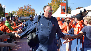 Oct 19, 2024; Champaign, Illinois, USA; Illinois Fighting Illini head coach Bret Bielema leads his team into the stadium before kickoff against the Michigan Wolverines game at Memorial Stadium. Mandatory Credit: Ron Johnson-Imagn Images