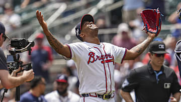 May 15, 2025; Cumberland, Georgia, USA; Atlanta Braves pitcher Raisel Iglesias (26) reacts with catcher Drake Baldwin (30) after the final out against the Washington Nationals during the ninth inning at Truist Park. Mandatory Credit: Dale Zanine-Imagn Images
