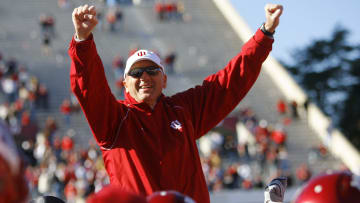 Indiana football head coach Terry Hoeppner raised on players' shoulders as the crowd chanted his name in 2006.