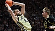 Purdue Boilermakers center Oscar Cluff (45) looks to pass the ball