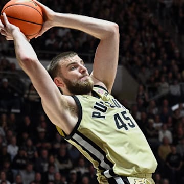 Purdue Boilermakers center Oscar Cluff (45) looks to pass the ball