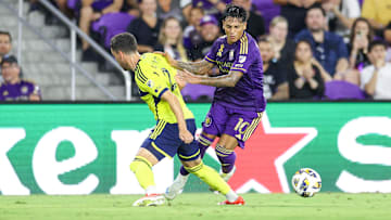 Aug 31, 2024; Orlando, Florida, USA; Orlando City midfielder Facundo Torres (10) controls the ball from Nashville SC defender Daniel Lovitz (2) in the second half at Inter&Co Stadium. Mandatory Credit: Nathan Ray Seebeck-USA TODAY Sports