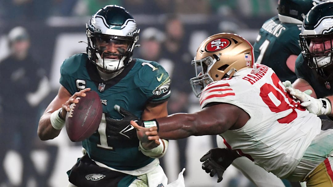 Dec 3, 2023; Philadelphia, Pennsylvania, USA; Philadelphia Eagles quarterback Jalen Hurts (1) is tackled by San Francisco 49ers defensive tackle Javon Hargrave (98) during the fourth quarter at Lincoln Financial Field. Mandatory Credit: Eric Hartline-Imagn Images