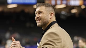 Jan 2, 2025; New Orleans, LA, USA; Tim Tebow waves to fans in the stands prior to the game between the Notre Dame Fighting Irish and the Georgia Bulldogs at Caesars Superdome. Mandatory Credit: Amber Searls-Imagn Images