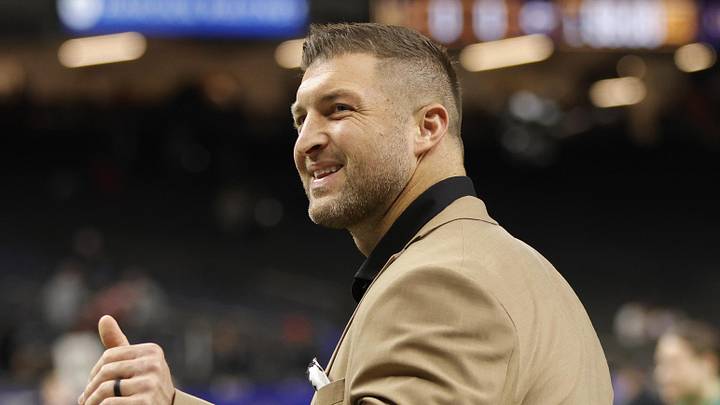 Jan 2, 2025; New Orleans, LA, USA; Tim Tebow waves to fans in the stands prior to the game between the Notre Dame Fighting Irish and the Georgia Bulldogs at Caesars Superdome. Mandatory Credit: Amber Searls-Imagn Images
