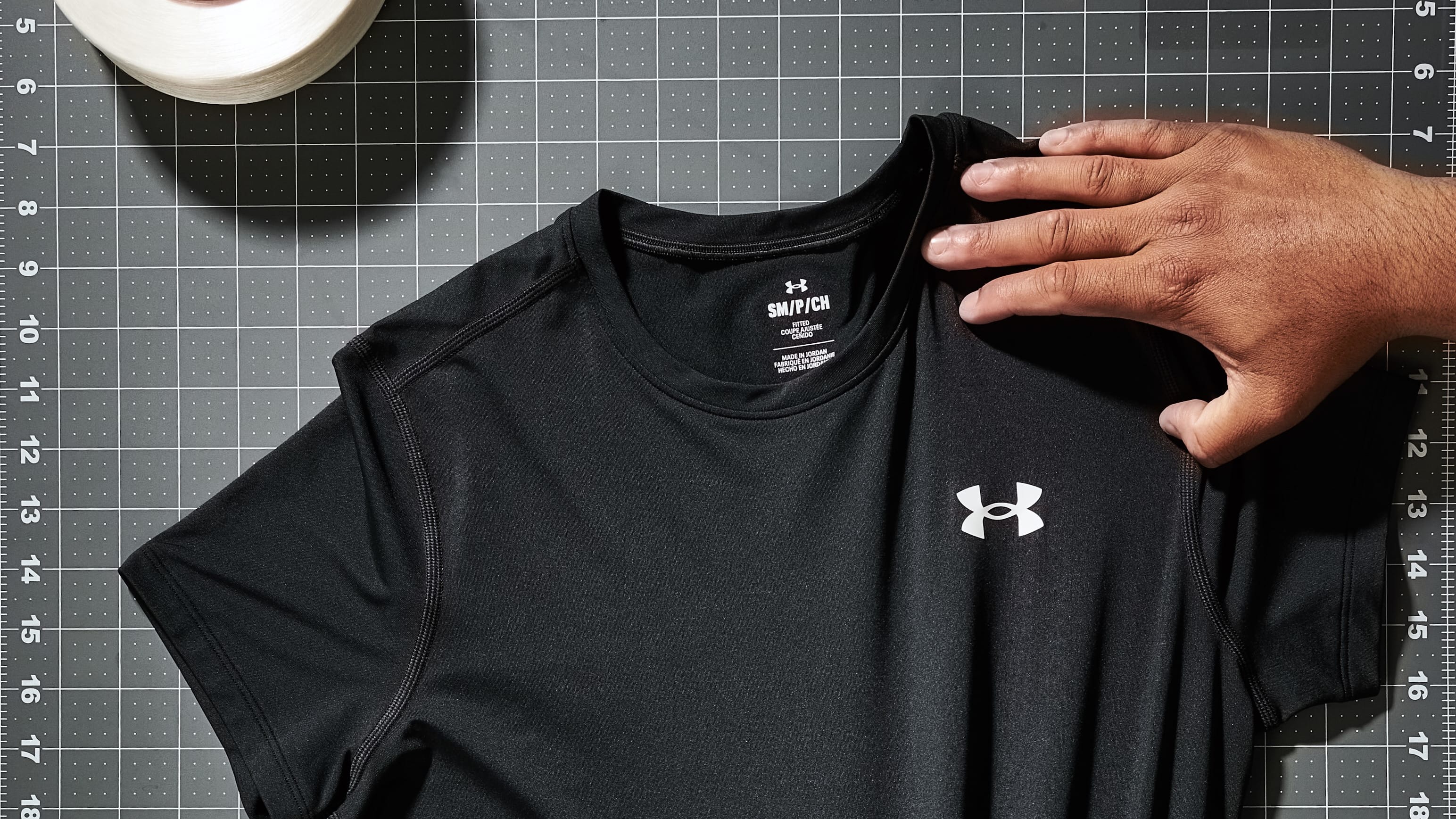 A black Under Armour shirt stretched out.