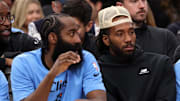 Nov 17, 2024; Inglewood, California, USA;  Los Angeles Clippers guard James Harden (1, left) and Kawhi Leonard (right) watch the game against the Utah Jazz from the bench during the fourth quarter at Intuit Dome. Mandatory Credit: Kiyoshi Mio-Imagn Images