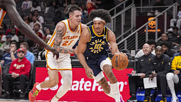 Oct 8, 2024; Atlanta, Georgia, USA; Indiana Pacers guard Kendall Brown (10) dribbles past Atlanta Hawks guard Vit Krejci (27) during the second half at State Farm Arena. Mandatory Credit: Dale Zanine-Imagn Images