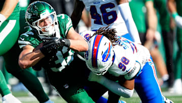 New York Jets running back Isaiah Davis (32) is tackled by Buffalo Bills defensive tackle T.J. Sanders (98), Sunday, September 14, 2025, in East Rutherford.