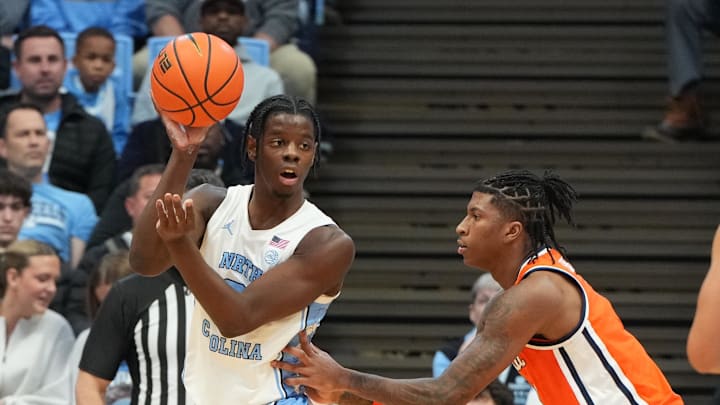 A key player is out for the Tar Heels, while No. 16 North Carolina is a small betting favorite at Syracuse basketball.