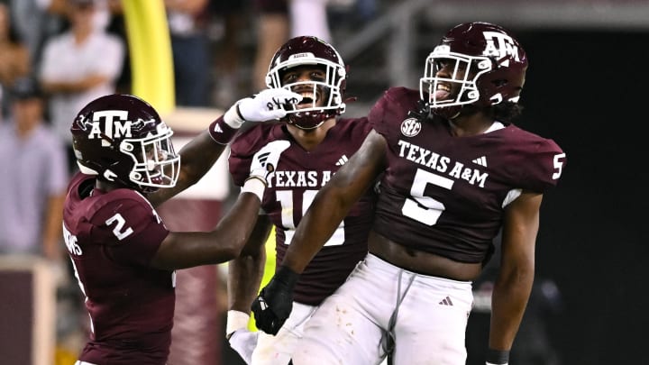 Sep 2, 2023; College Station, Texas, USA; Texas A&M Aggies defensive back Jacoby Mathews (2), defensive lineman Fadil Diggs (10) and defensive lineman Shemar Turner (5) react to a tackle for a loss during the fourth quarter against the New Mexico Lobos at Kyle Field. Mandatory Credit: Maria Lysaker-USA TODAY Sports
