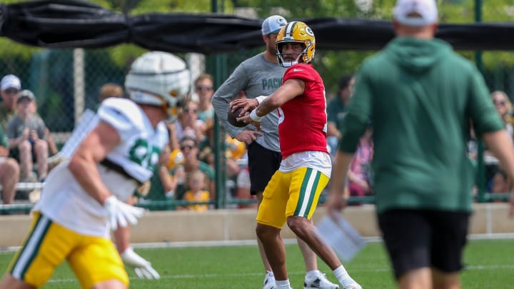 Green Bay Packers quarterback Jordan Love (10) passes the ball to tight end Luke Musgrave on Tuesday at Packers training camp.