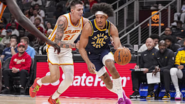 Oct 8, 2024; Atlanta, Georgia, USA; Indiana Pacers guard Kendall Brown (10) dribbles past Atlanta Hawks guard Vit Krejci (27) during the second half at State Farm Arena. Mandatory Credit: Dale Zanine-Imagn Images