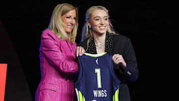 Apr 14, 2025; New York, New York, USA; Paige Bueckers poses with WNBA commissioner Cathy Engelbert after being selected with the number one overall pick to the Dallas Wings in the 2025 WNBA Draft at The Shed at Hudson Yards.