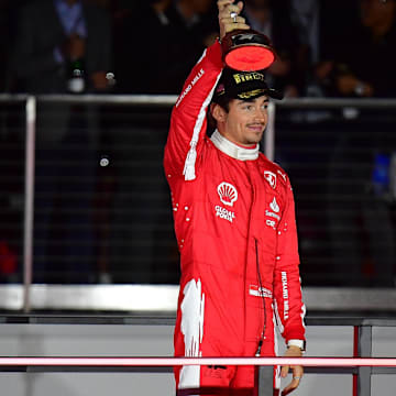 Nov 18, 2023; Las Vegas, Nevada, USA; Scuderia Ferrari driver Charles LeClerc of Monaco (16) celebrates after placing second in the Las Vegas Grand Prix at Las Vegas Strip Circuit. Mandatory Credit: Gary A. Vasquez-Imagn Images