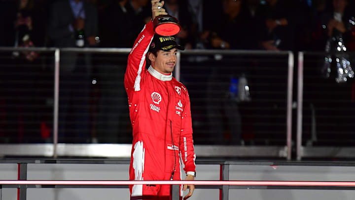 Nov 18, 2023; Las Vegas, Nevada, USA; Scuderia Ferrari driver Charles LeClerc of Monaco (16) celebrates after placing second in the Las Vegas Grand Prix at Las Vegas Strip Circuit. Mandatory Credit: Gary A. Vasquez-Imagn Images