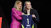 Apr 14, 2025; New York, New York, USA; Paige Bueckers poses with WNBA commissioner Cathy Engelbert after being selected with the number one overall pick to the Dallas Wings in the 2025 WNBA Draft at The Shed at Hudson Yards. Mandatory Credit: Vincent Carchietta-Imagn Images