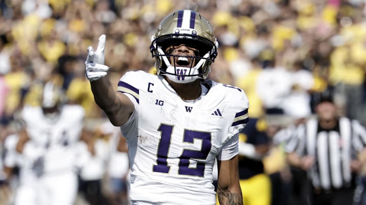 Oct 18, 2025; Ann Arbor, Michigan, USA;  Washington Huskies wide receiver Denzel Boston (12) celebrates after he makes a reception in the first half against the Michigan Wolverines at Michigan Stadium. Mandatory Credit: Rick Osentoski-Imagn Images