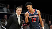 St. John's Red Storm guard RJ Luis Jr. (12) speaks with head coach Rick Pitino during the second half of a game against the Butler Bulldogs on Wednesday, Feb. 26, 2025, at Hinkle Fieldhouse in Indianapolis. St. John’s defeated Butler 76-70.