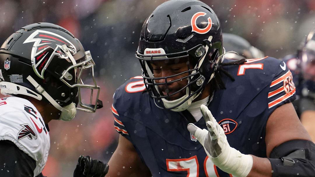 Dec 31, 2023; Chicago, Illinois, USA; Chicago Bears offensive lineman Braxton Jones (70) blocks against the Atlanta Falcons at Soldier Field. Dec 31, 2023; Chicago, Illinois, USA; Chicago Bears offensive lineman Braxton Jones (70) blocks against the Atlanta Falcons at Soldier Field.