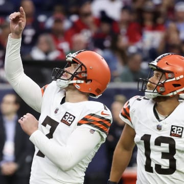 Dec 24, 2023; Houston, Texas, USA; Cleveland Browns place kicker Dustin Hopkins (7) celebrates his extra point with holder Corey Bojorquez (13) against the Houston Texans in the second quarter at NRG Stadium. Mandatory Credit: Thomas Shea-USA TODAY Sports