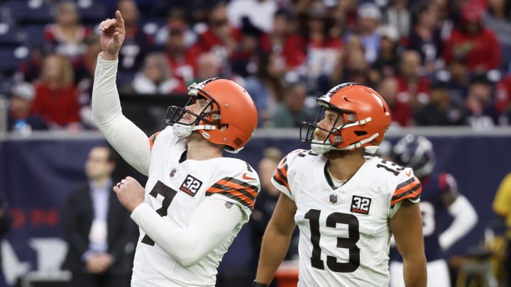 Dec 24, 2023; Houston, Texas, USA; Cleveland Browns place kicker Dustin Hopkins (7) celebrates his extra point with holder Corey Bojorquez (13) against the Houston Texans in the second quarter at NRG Stadium. Mandatory Credit: Thomas Shea-USA TODAY Sports