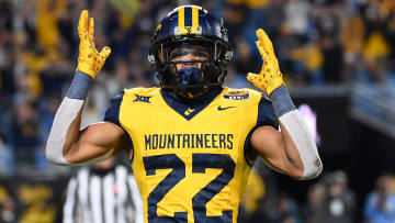 West Virginia Mountaineers running back Jahiem White (22) reacts after scoring a touchdown in the fourth quarter at Bank of America Stadium. 