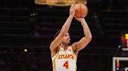 Oct 14, 2024; Atlanta, Georgia, USA; Atlanta Hawks guard Kobe Bufkin (4) shoots against the Philadelphia 76ers in the third quarter at State Farm Arena. Mandatory Credit: Brett Davis-Imagn Images