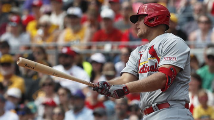 Jun 4, 2023; Pittsburgh, Pennsylvania, USA;  St. Louis Cardinals designated hitter Luken Baker (26) hits a single for his first MLB hit in his major league debut against the Pittsburgh Pirates during the second inning at PNC Park. Mandatory Credit: Charles LeClaire-USA TODAY Sports