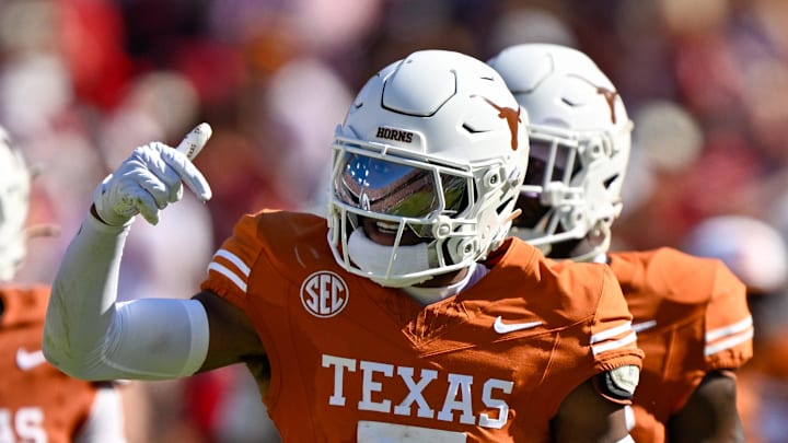 Oct 11, 2025; Dallas, Texas, USA; Texas Longhorns defensive back Malik Muhammad (5) celebrates after an interception during the game between the Texas Longhorns and the Oklahoma Sooners at the Cotton Bowl. 