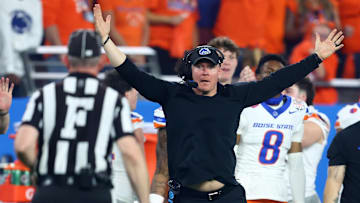 Dec 31, 2024; Glendale, AZ, USA; Boise State Broncos head coach Spencer Danielson reacts toward the referee against the Penn State Nittany Lions during the first half in the Fiesta Bowl at State Farm Stadium. Mandatory Credit: Mark J. Rebilas-Imagn Images