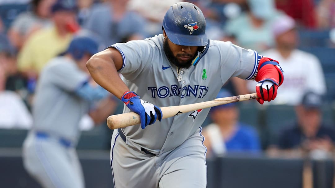 May 24, 2025; Tampa, Florida, USA; Toronto Blue Jays first baseman Vladimir Guerrero Jr. (27) breaks hit bat on a ground ball against the Tampa Bay Rays in the third inning at George M. Steinbrenner Field. 