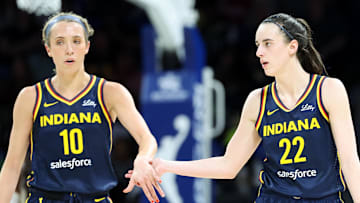 May 3, 2024; Dallas, Texas, USA; Indiana Fever guard Caitlin Clark (22) celebrates with Indiana Fever guard Lexie Hull (10) during the second quarter against the Dallas Wings at College Park Center.  Mandatory Credit: Kevin Jairaj-Imagn Images