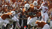 Oct 8, 2005; Dallas, TX, USA; Texas Longhorns  #90 Rodrique Wright runs a fumble recovery back for a touchdown against Oklahoma Sooners in the fourth quarter during Red River Shootout at Cotton Bowl. Longhorns beat the Sooners 45-12. Mandatory Credit: Photo By Matthew Emmons- Imagn Images
