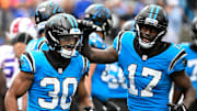 Oct 26, 2025; Charlotte, North Carolina, USA; Carolina Panthers running back Chuba Hubbard (30) celebrates with wide receiver Xavier Legette (17) after scoring a touchdown in the fourth quarter against the Buffalo Bills at Bank of America Stadium. 