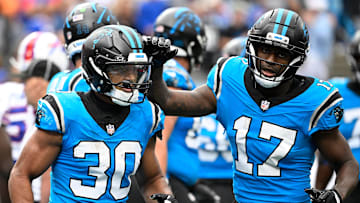 Oct 26, 2025; Charlotte, North Carolina, USA; Carolina Panthers running back Chuba Hubbard (30) celebrates with wide receiver Xavier Legette (17) after scoring a touchdown in the fourth quarter against the Buffalo Bills at Bank of America Stadium. 
